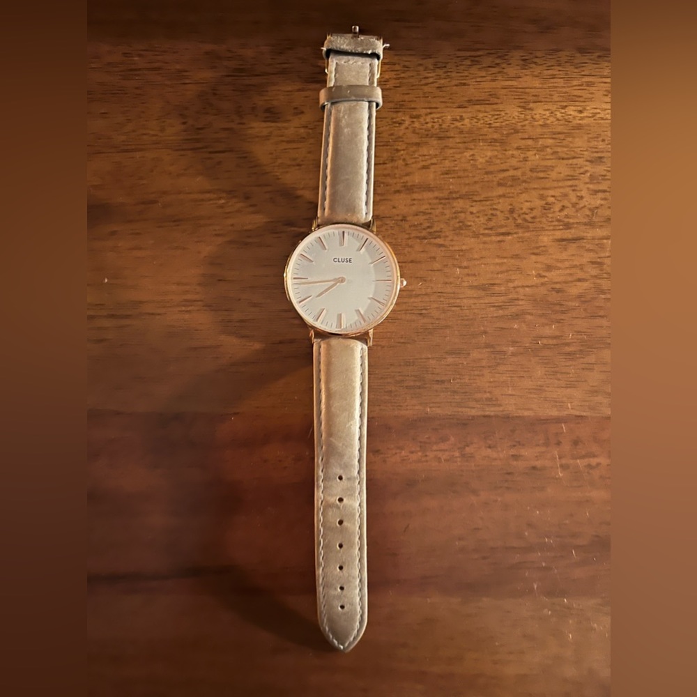 Women’s leather band Cluse Boho Chic watch with rose gold trim and white face.